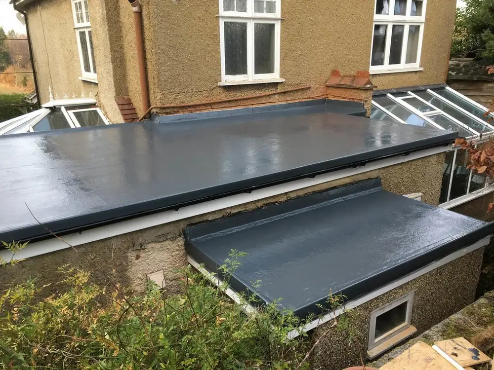 Completed dark flat roof covering on a house extension in Lancashire