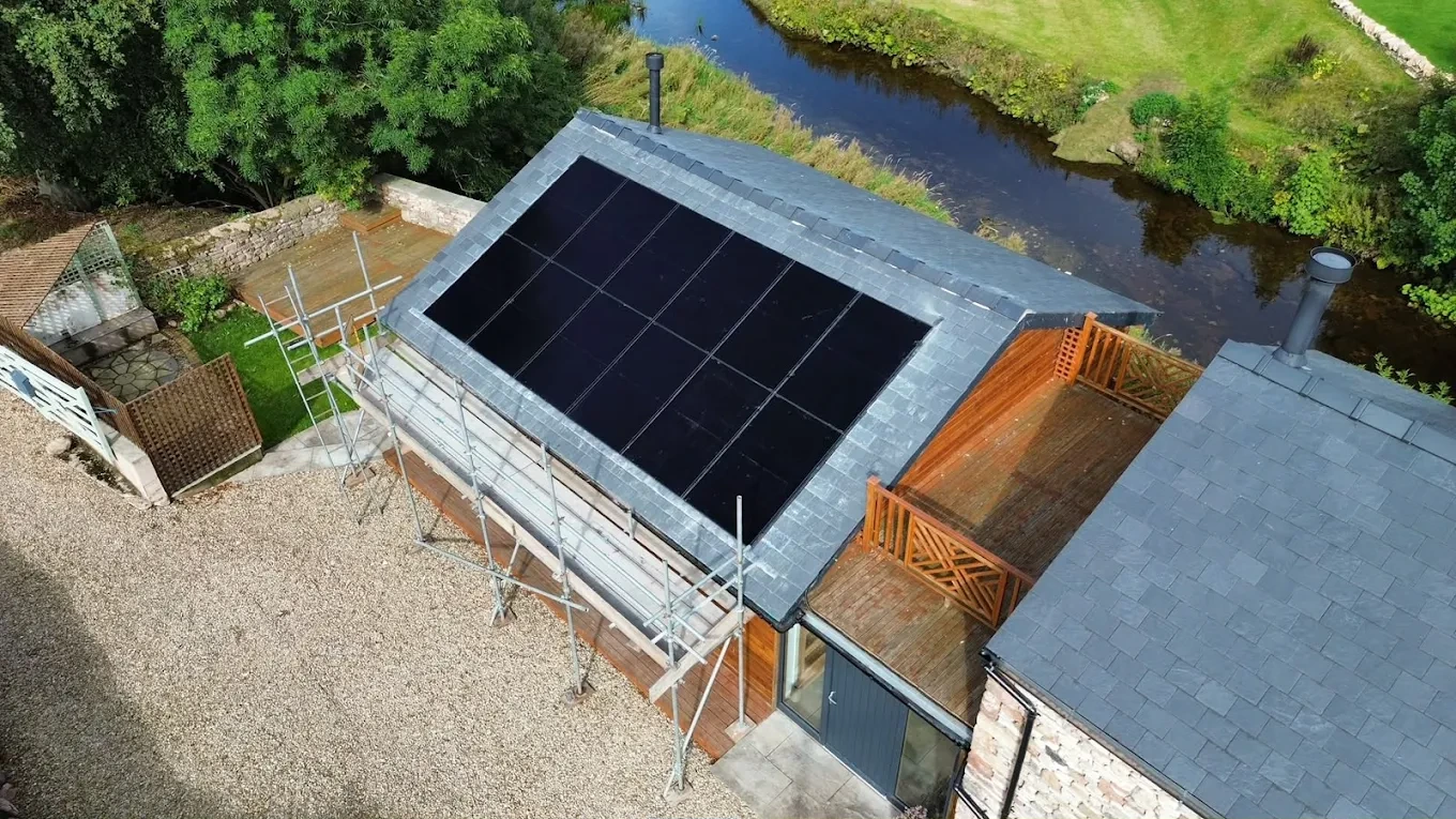 Aerial view of a solar panel array on a slate roof